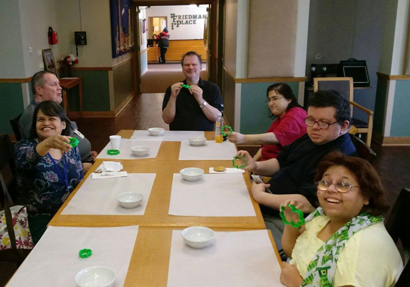 Residents making Rice Krispies treats