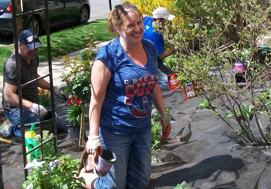 Rita helps landscape the grounds of Friedman Place with volunteers and staff.