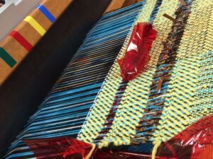 A woven tapestry, part of the collaboration between Julia Miller and residents, "Blind Weavers Explore Sound"